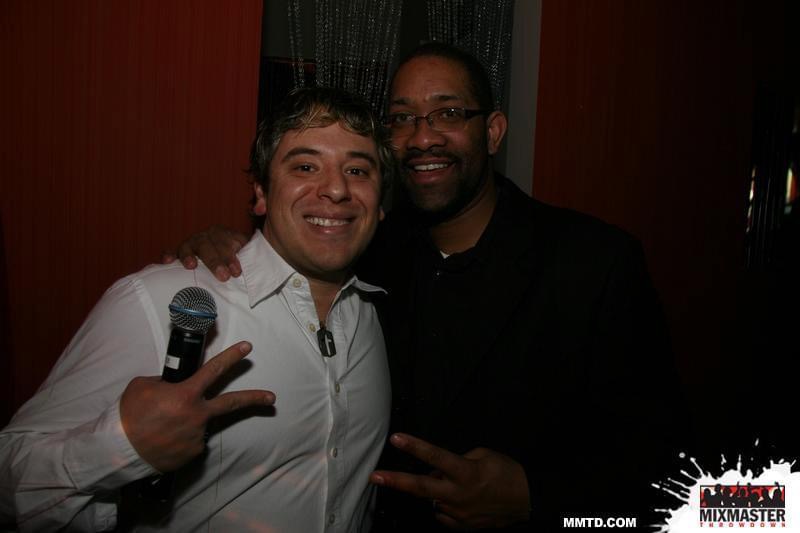 DJ Holland with a Chicago Mixmaster holding a microphone